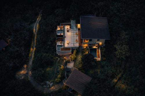 an aerial view of a house at night at The Capoe House - By Mountain Boutiques Luxury Collection in Haputale