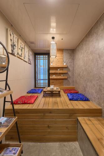 a room with two beds with pillows on the floor at Artravel Myeongdong in Seoul
