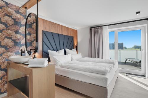 Voodi või voodid majutusasutuse Deichloft toas