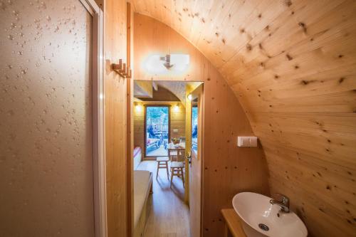 a small bathroom with a sink and a mirror at Camping Cala Llevado in Tossa de Mar