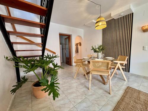 a dining room with a table and chairs at Casa Verde 56 in Cumbre del Sol