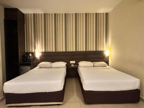 two beds in a hotel room with at My Hotel @ Sentral in Kuala Lumpur