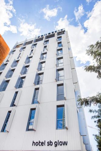 a tall white building with the hotel so green at Hotel SB Glow 4 Sup in Barcelona
