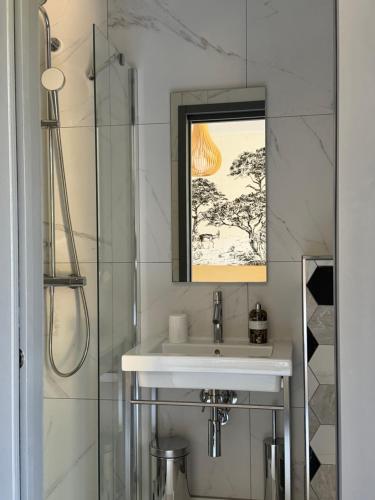 a bathroom with a sink and a shower at Kyrn Flor - Domaine Sant Antone in Corte