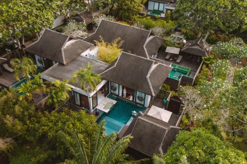 an aerial view of a villa with a swimming pool at Anantara Mai Khao Phuket Villas in Mai Khao Beach