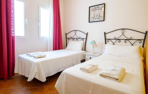 two beds sitting next to each other in a room at Sirius in La Isleta del Moro