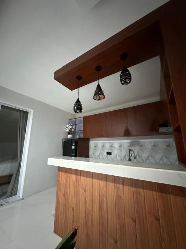 a kitchen with a sink and a counter top at Agustik Villas in Badung