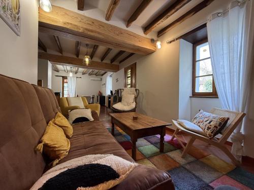 a living room with a couch and a table at Xuhinxaharea in Banca