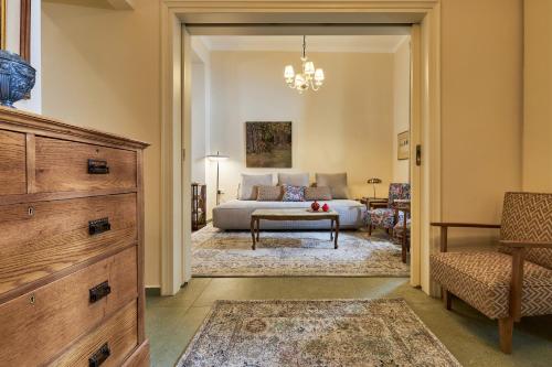 a living room with a bed and a couch at Vava Residence in Heraklio
