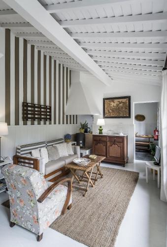 a living room with a couch and a table at Casa Vitoriana in Ponta Delgada