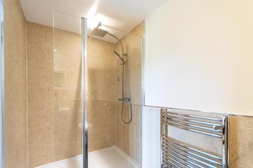 a shower with a glass door in a bathroom at 3 Bed in Goldenbank oc-c29977 in Falmouth