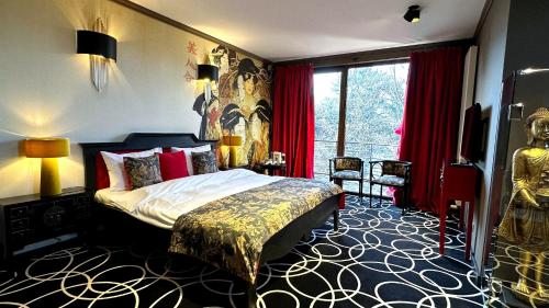 a bedroom with a bed and a large window at Relax in Style Boutique Hotel in Braşov