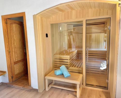 a sauna with a blue pillow sitting on a bench at Honor - Rustic villa for 16 people in Bunyola