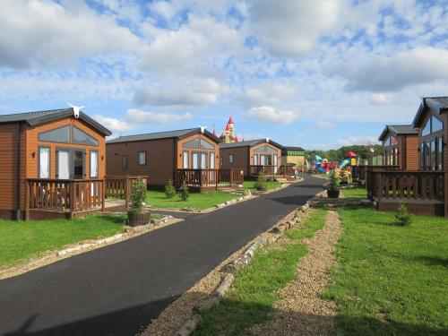 a row of houses on a residential street at Gulliver's Valley, M1, JCT 31 in Rotherham