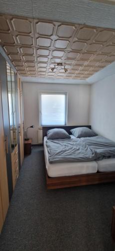 a bedroom with a large bed in a room at Bungalow Helga in Fürstenwalde