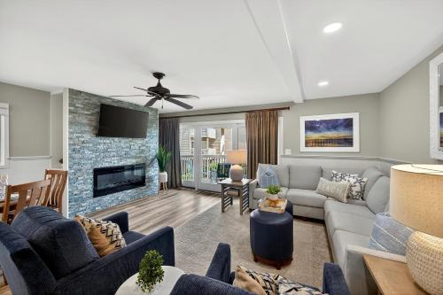 a living room with a couch and a fireplace at SG8A: 8A Seagrove Villa in Isle of Palms