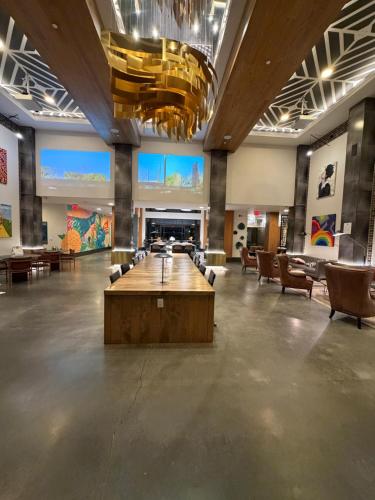 a large lobby with a large table and chairs at Luxury Downtown Houston Skyline Suite in Houston