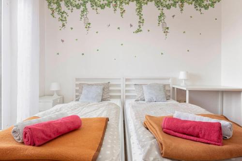 a bedroom with two beds with towels on them at Bella Vista apartments in Koper