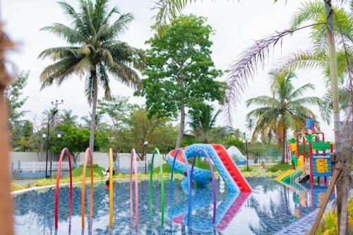a pool with a water park with a water slide at Santorini VIP Apartment Negombo in Negombo