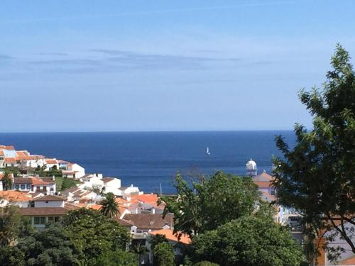 a view of a city with the ocean in the background at À Descoberta d'Angra! in Angra do Heroísmo