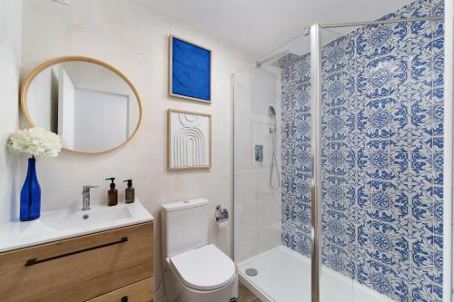 a bathroom with a shower and a toilet and a sink at Casa Margot Old Town Rooftop Walk Promenade in Portimão