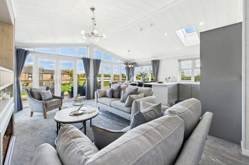 a large living room with couches and a table at Host & Stay - Marble Lodge in Beverley