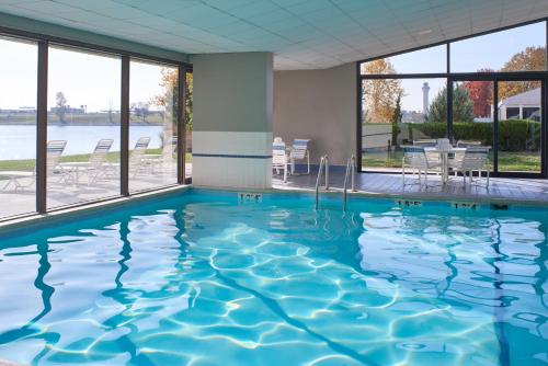 a swimming pool with a view of the water at Kansas City Airport Marriott in Kansas City