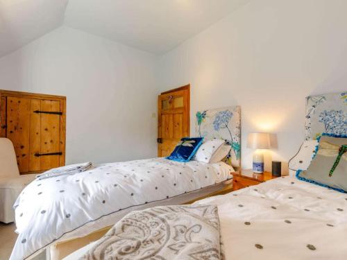 a bedroom with two beds and a table at 2 Bed in Ashbourne oc-82579 in Longford