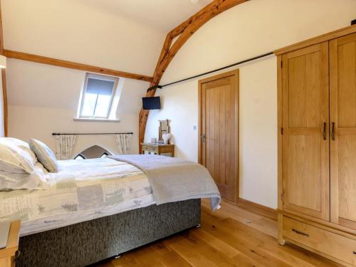 a bedroom with a bed and a window at 3 Bed in Buxton oc-52891 in Sheen