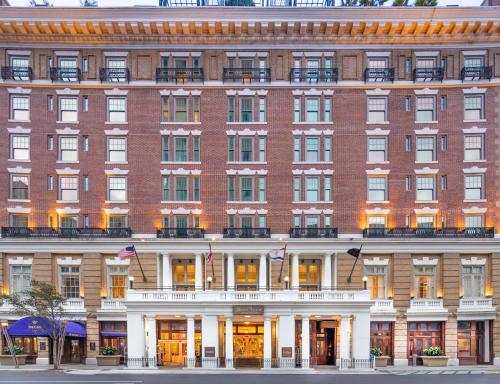 a large red brick building with a white facade at The Battle House Renaissance Mobile Hotel & Spa in Mobile