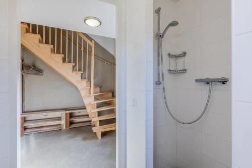 a bathroom with a staircase and a shower at Landal Winterberg in Winterberg