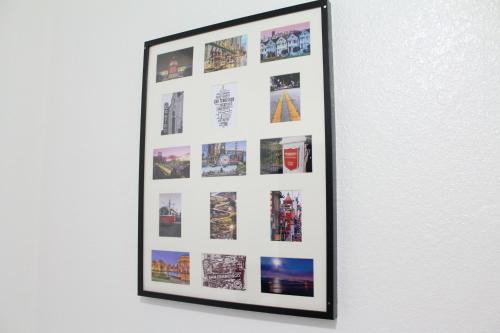 a framed picture of cities on a wall at Union Hotel in San Francisco