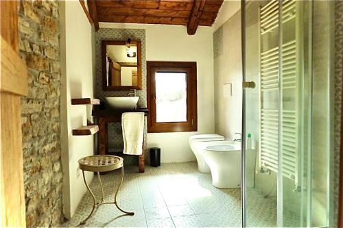 a bathroom with a toilet and a sink at BeB La Bergera in Cessole