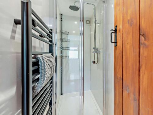 a glass walk in shower in a bathroom at 2 Bed in Leek oc-52923 in Grindon