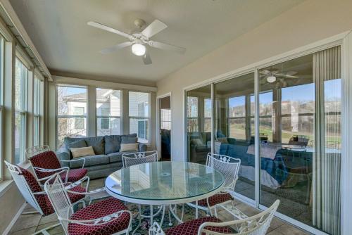 a living room with a glass table and chairs at Gorgeous Condos at Thousand Hills - Heart of Branson - Spacious and Affordable in Branson