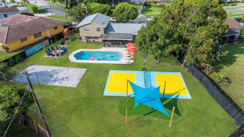an aerial view of a backyard with a pool at Your own 5BR Private Oasis! wPrivate PoolPickleball in West Palm Beach