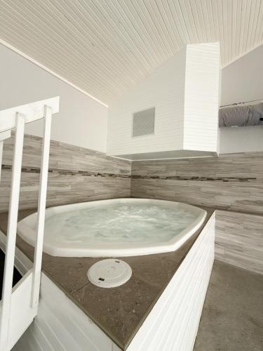 a bathroom with a jacuzzi tub in a room at The Little Penthouse in Lake Ozark