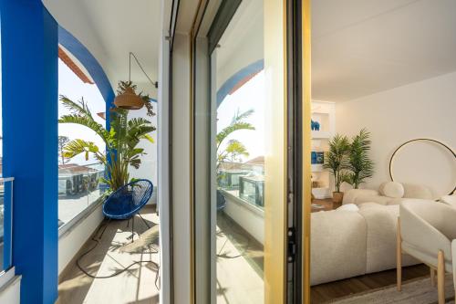 a room with a view of a living room at Alojamento Costa Alentejana in Zambujeira do Mar
