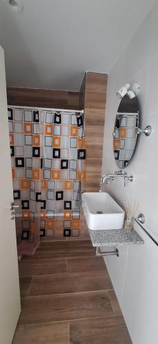 a bathroom with a sink and a mirror at La Raquel in La Plata