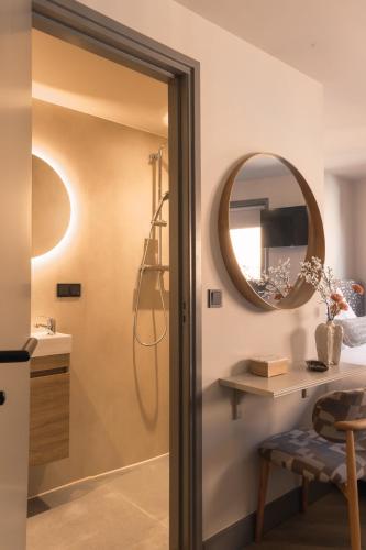 a bathroom with a shower and a mirror at Hotel Central Staytion in Amsterdam