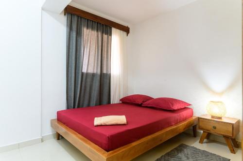 Llit o llits en una habitació de Sitraka Résidence