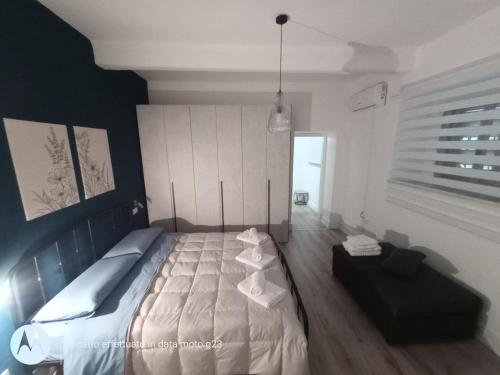 a bedroom with a large bed in a room at Irisapartment in Reggio di Calabria
