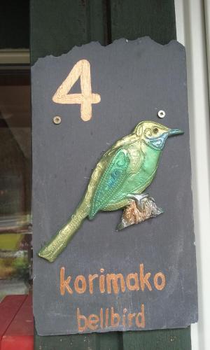 a book with a bird on top of it at Arthur's Pass Alpine Motel in Arthur's Pass