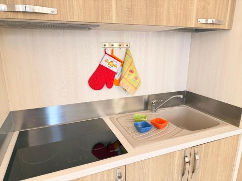 a kitchen with a sink and a counter top at Luxury House Gallipoli in Gallipoli