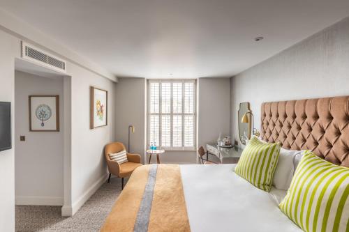 a bedroom with a large bed and a window at Harbour Hotel & Spa Bristol in Bristol