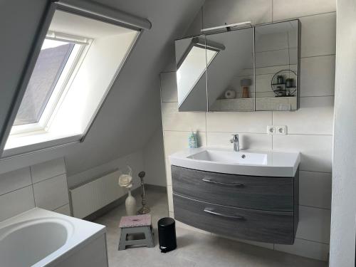 a bathroom with a sink and a mirror at Cora in Pruchten