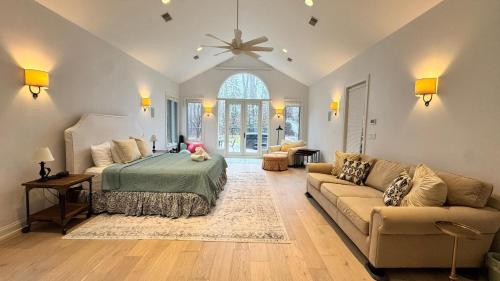 a bedroom with a bed and a couch at Ruffino Retreat in Union Pier