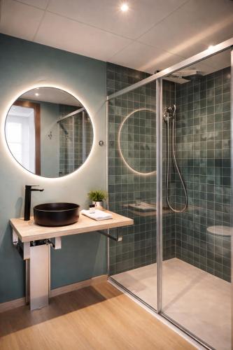 a bathroom with a sink and a shower at Aparthotel Montcada in Montcada i Reixac