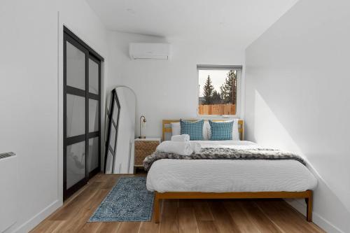 a bedroom with a bed and a window at Spacious w/ 2BR 2Bath - Big Bear in Big Bear City