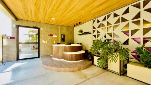 a lobby with a reception desk in a building at Studio Desing 3 - Lions Maceió in Maceió